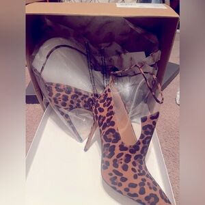 New, never worn ankle boots still in original box shoes came in.